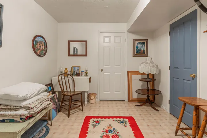 White paneled doors, light-toned flooring, and neutral wall color
