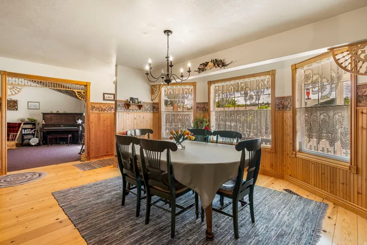Wood-finish flooring with wood paneling and decorative trim