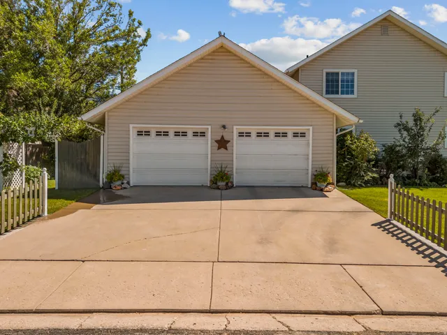 Two-car attached garage with horizontal panel doors