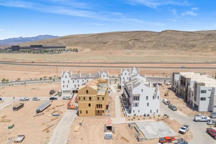 Desert landscape setting with a mix of completed and under-construction multi-story residential structures