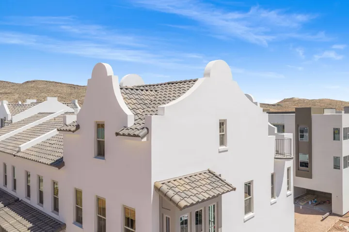 Stucco exterior with a stepped gable roofline