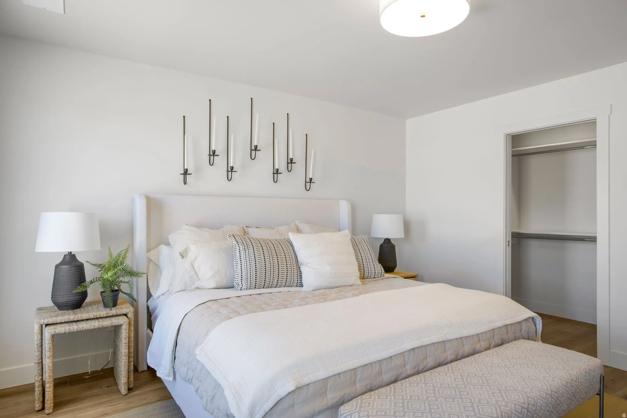 Recessed closet with shelving and hanging rods