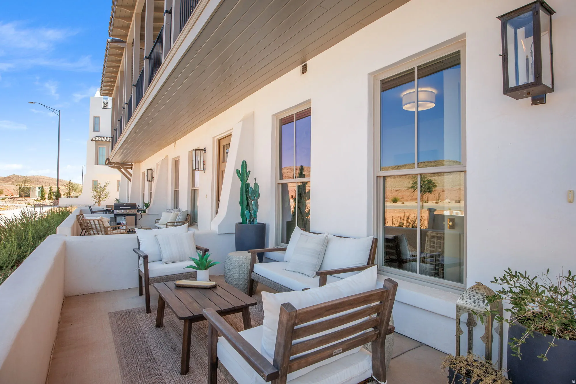 Private outdoor patio space featuring a stucco half-wall