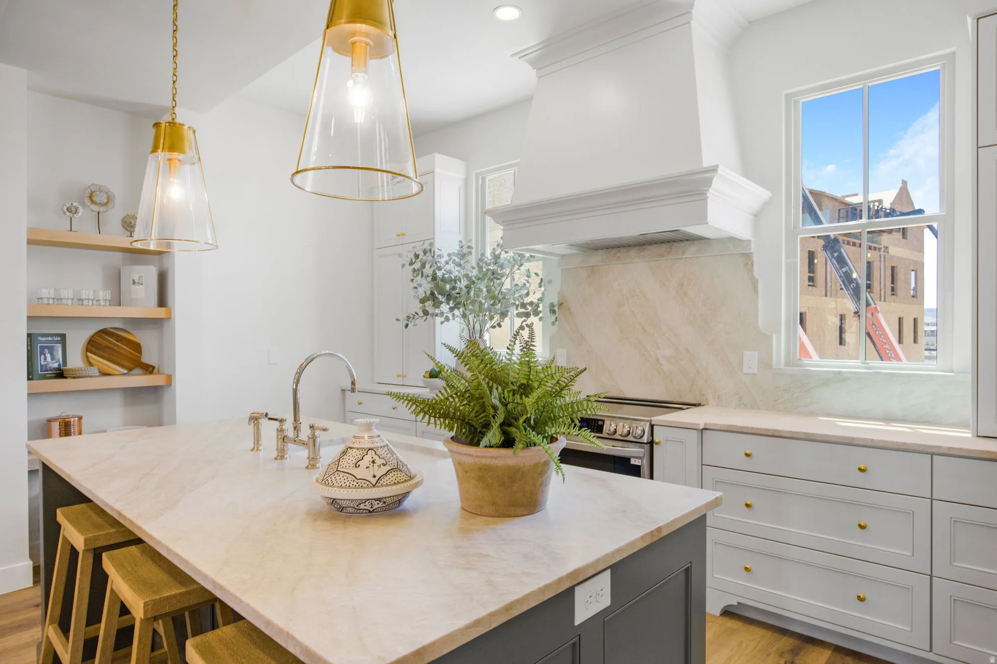 Kitchen island with an undermount sink and a polished chrome faucet