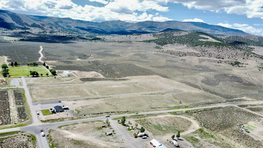 Expansive property featuring undeveloped land and distant mountains