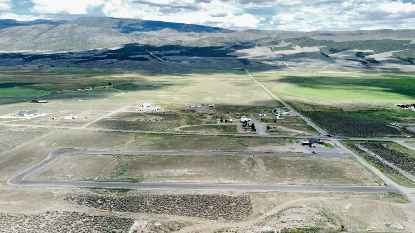 Expansive rural landscape with distant mountains