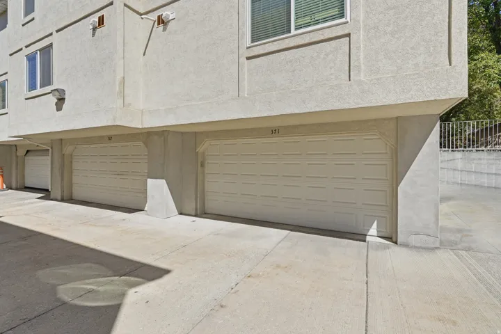 Attached garage parking with dual pane windows on upper levels