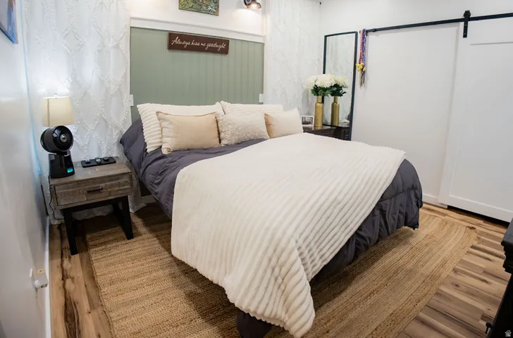 Wood-finish flooring with a textured area rug