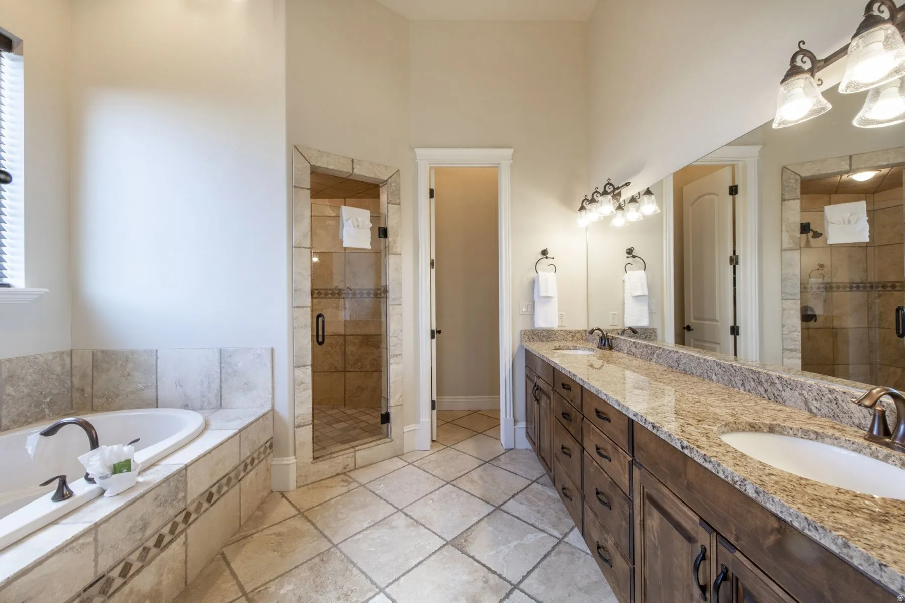 Dual vanity with undermount sinks and extensive countertop space