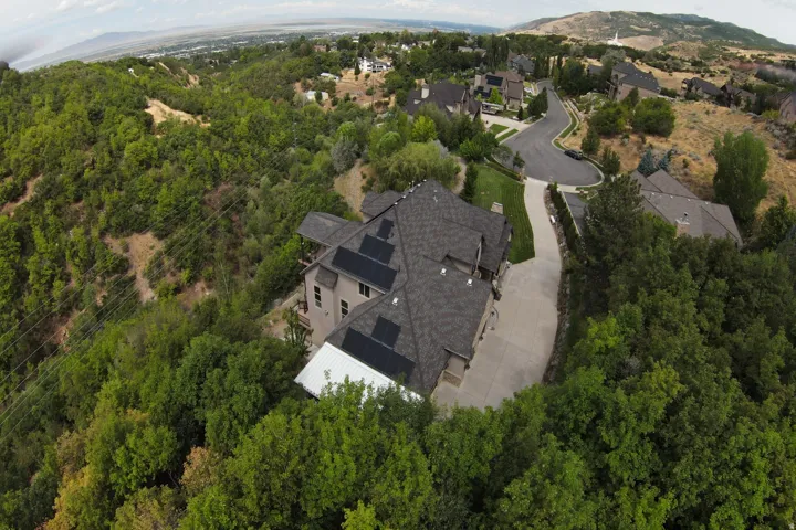 Sloped roofline with multiple solar panel installations