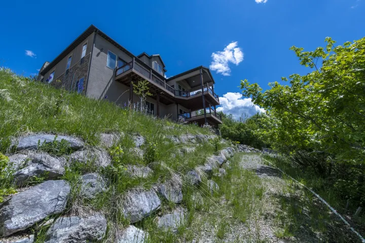 Multi-level exterior with stucco and stone accents