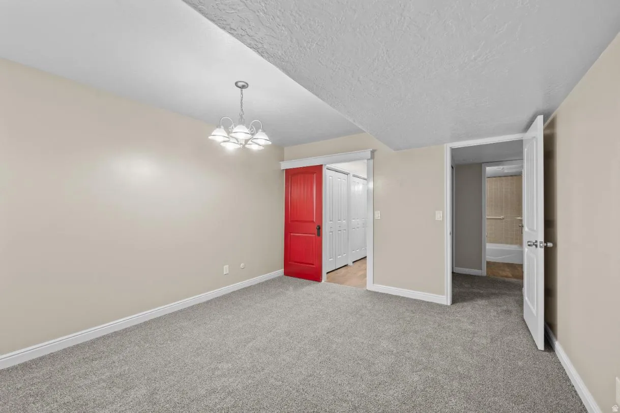 Gray carpeted flooring with light neutral wall paint