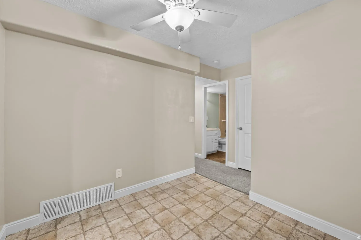 Tiled flooring complemented by neutral wall tones