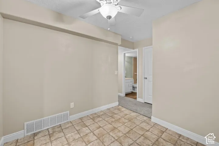 Tiled flooring complemented by neutral wall tones