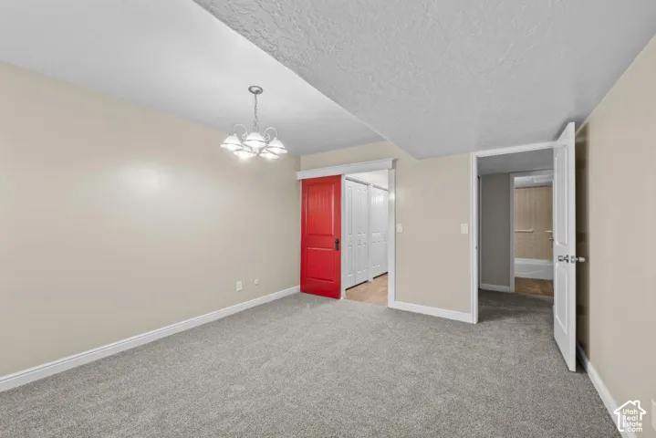 Gray carpeted flooring with light neutral wall paint