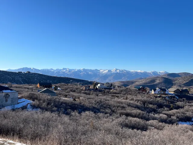 Expansive mountain scenery with distant snow-capped peaks