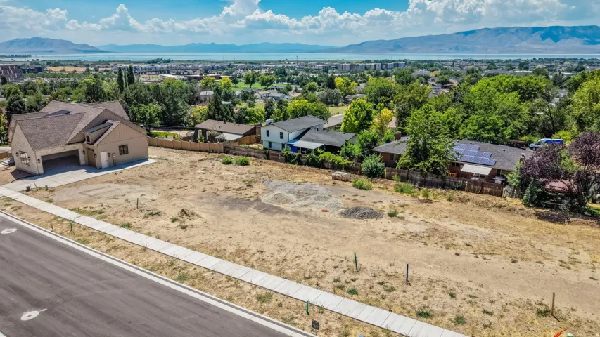 Newly constructed residence featuring a two-car garage, contemporary architectural design, and a concrete driveway