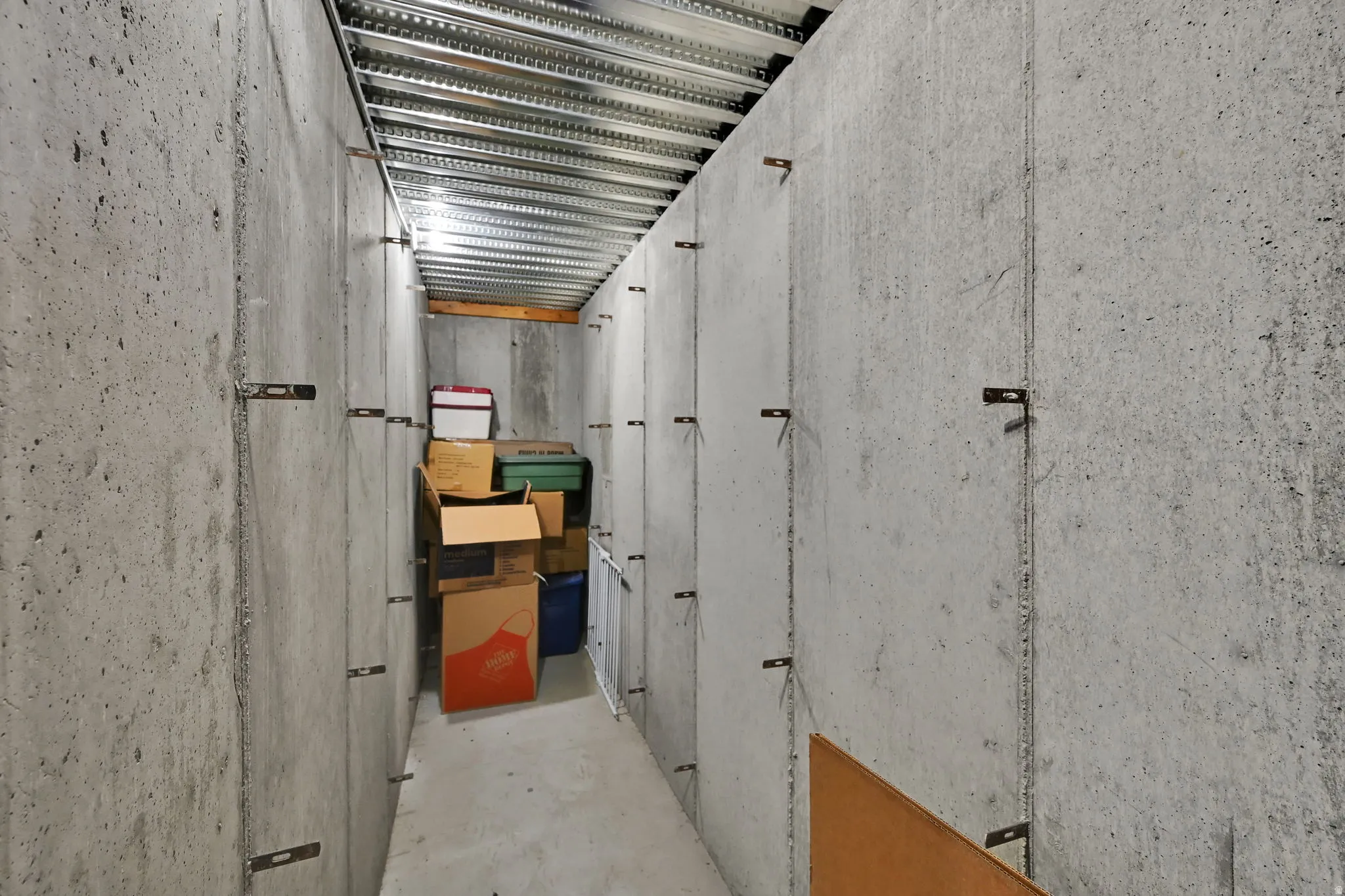 Concrete walls with exposed metal ceiling joists