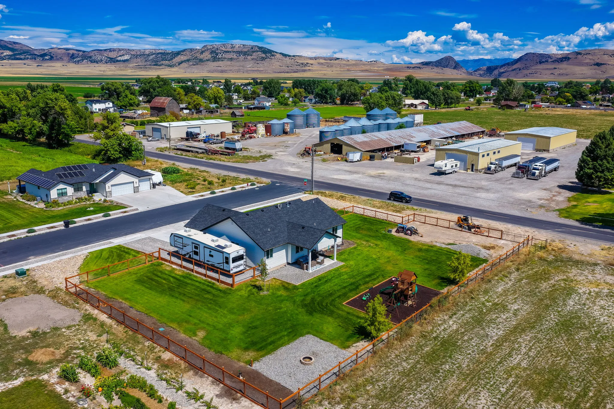 Single-story residence with an attached garage, covered patio, and fenced yard