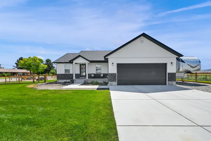 Contemporary single-story residence with a dark asphalt shingle roof