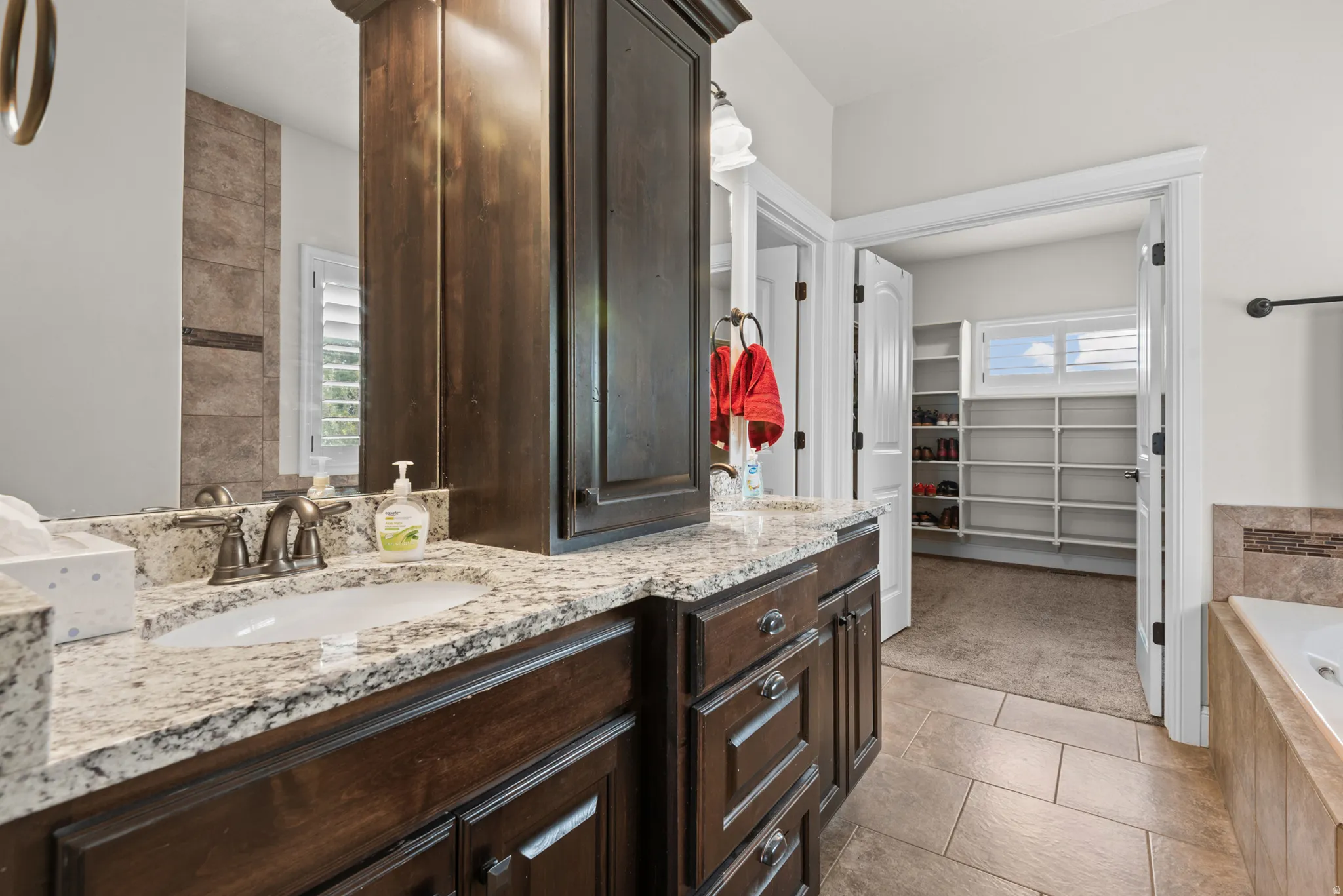 Dual vanity with granite countertop and integrated sinks