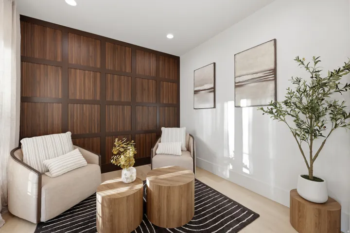 Full-height wood panel accent wall, light wood-finish flooring, recessed lighting, and crisp white walls