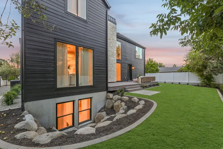 Black horizontal siding with stone accents