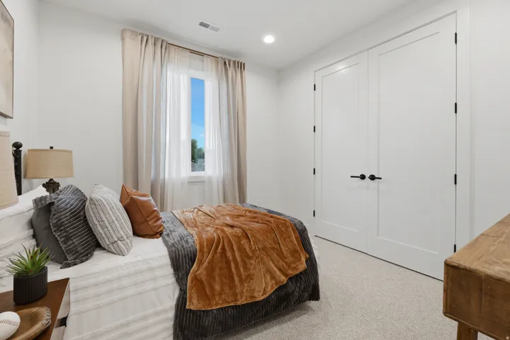 White walls featuring a single window, recessed lighting, and light-colored carpeting