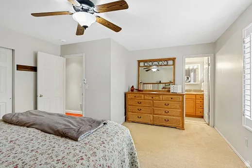 Primary Bedroom with a ceiling fan, and 3/4 bathroom