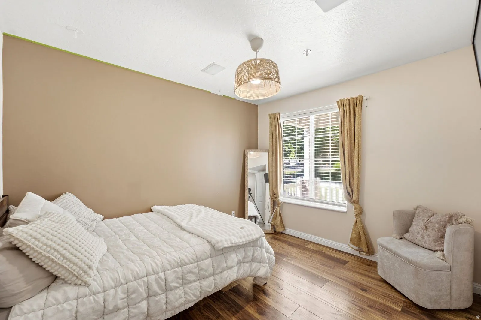 Wood-finish flooring with a white-trimmed window