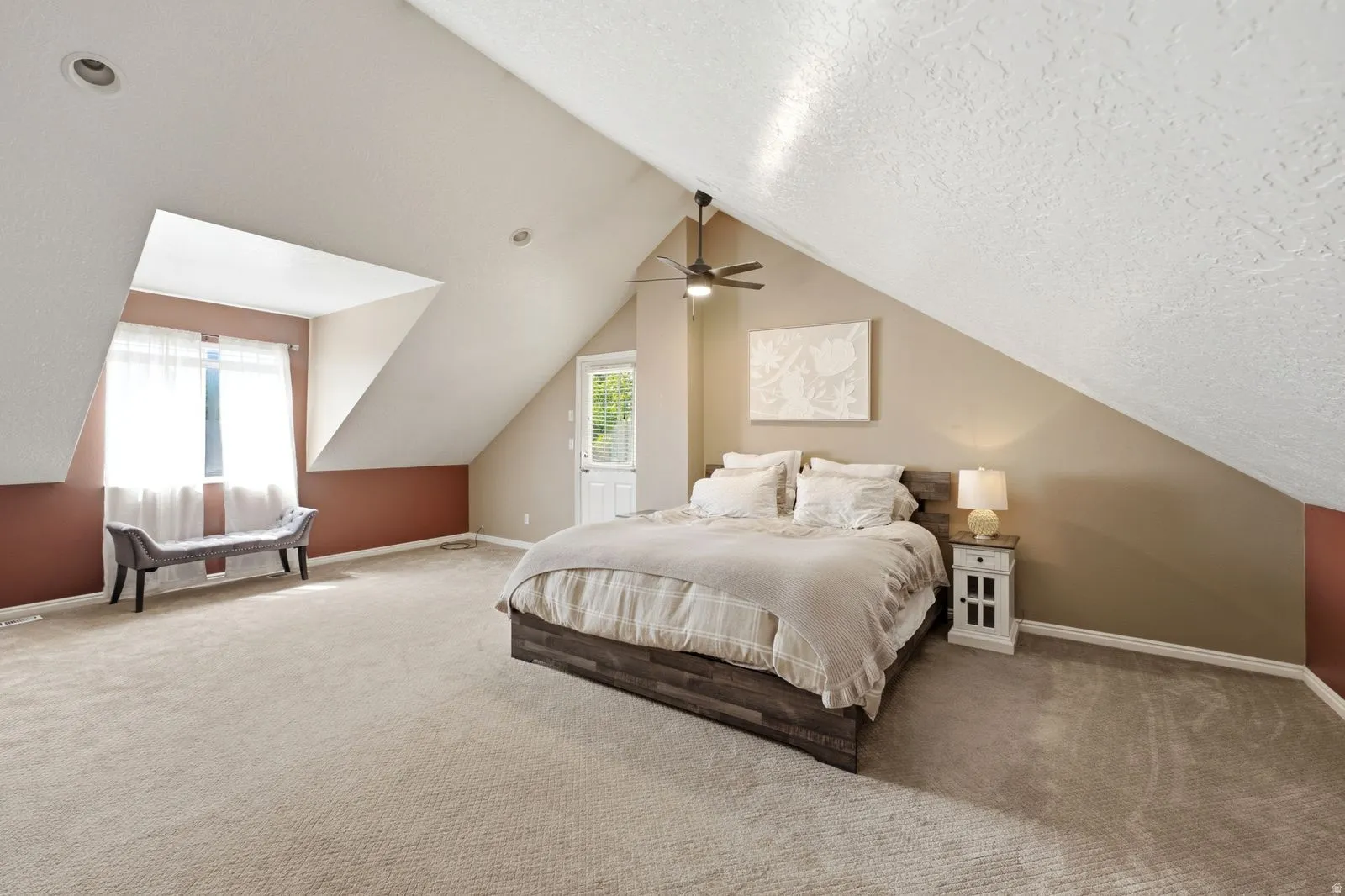 Sloped ceilings with recessed lighting, ceiling fan, and carpeted flooring