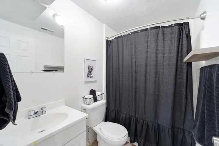 White vanity with an integrated sink and chrome faucet