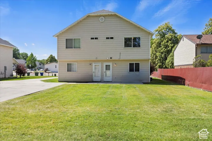 Two-story exterior with horizontal siding and multiple windows