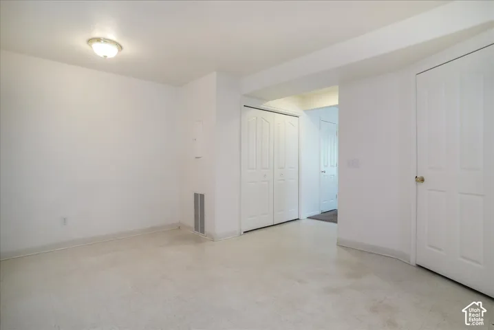 White walls with flush-mount ceiling light