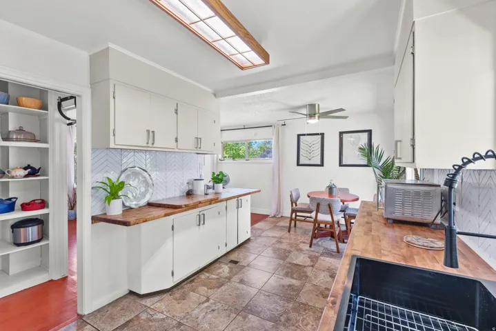 Kitchen featuring freshly painted cabinetry and new butcher block countertops!