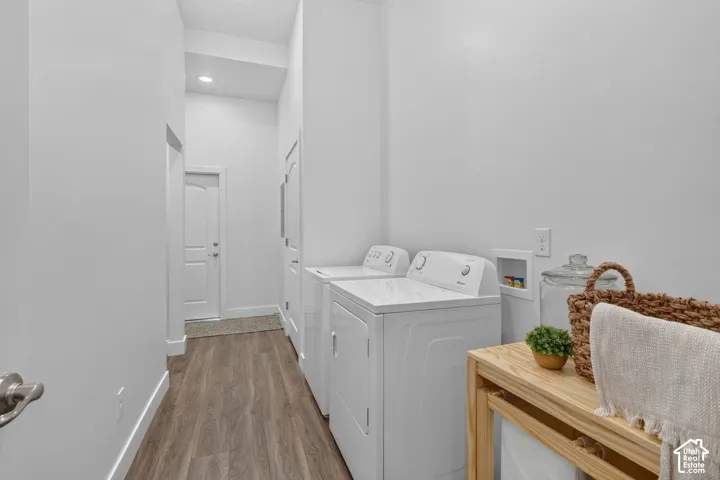 Laundry room with additional storage and access to the garage and common breezeway.