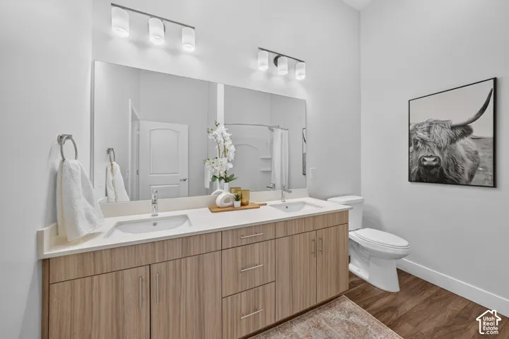 Primary Bathroom with double vanity and walk in shower