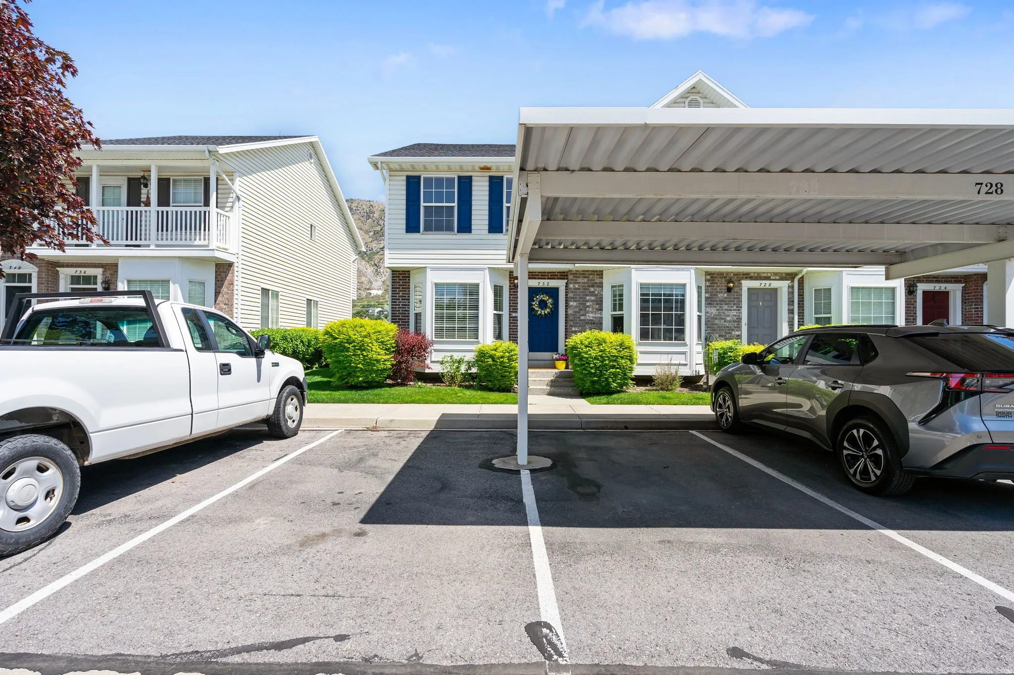 Carport parking with numbered spaces