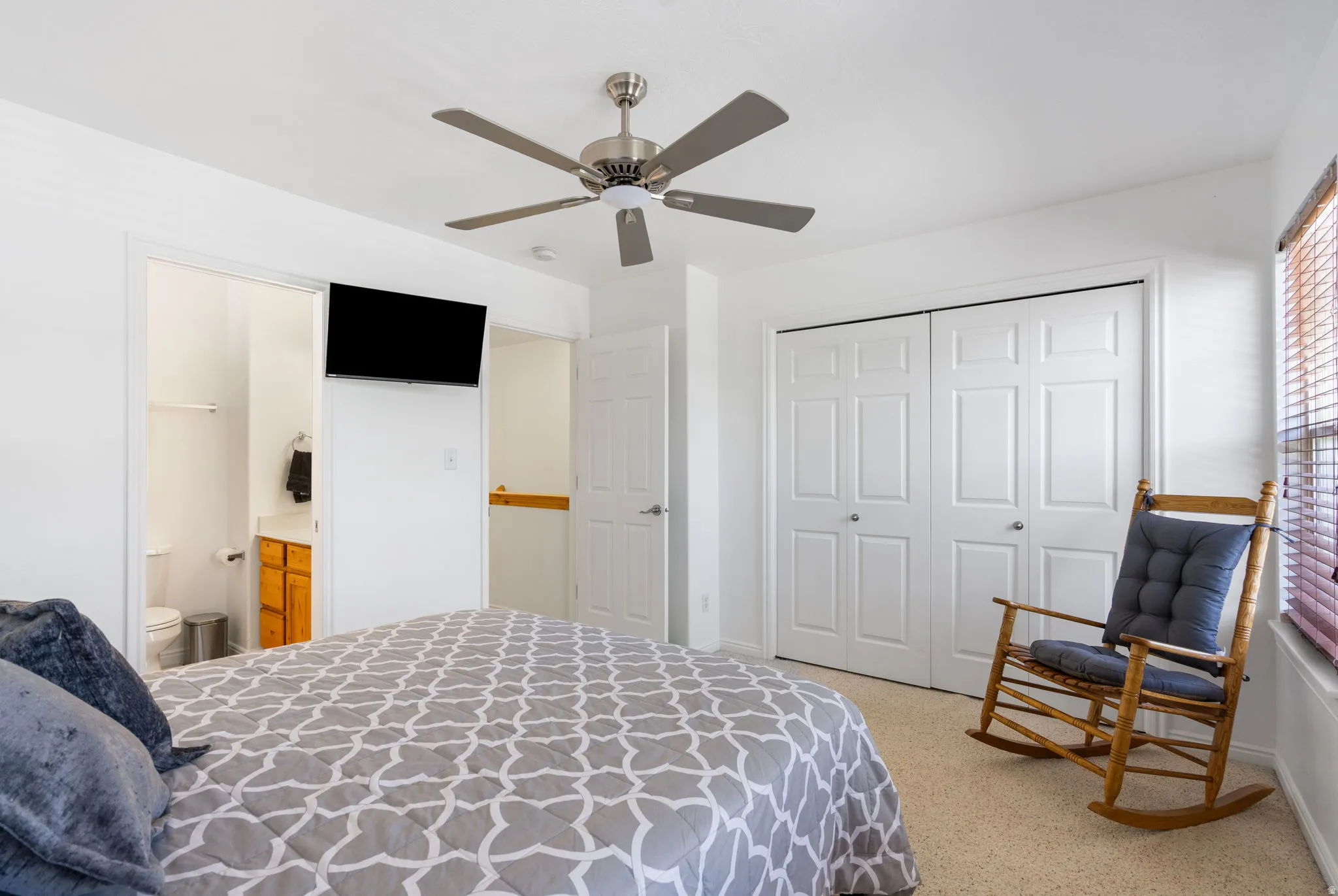 Recessed lighting, ceiling fan, carpet flooring, bi-fold closet doors, and wood-finish window blinds
