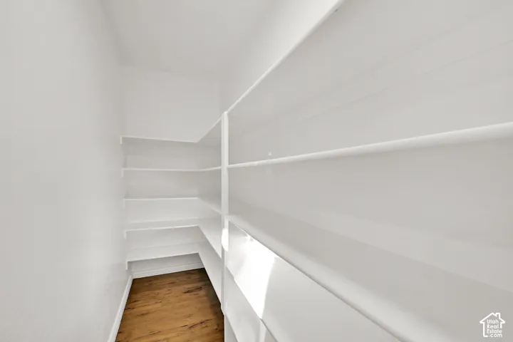 Full-height shelving with wood-finish flooring