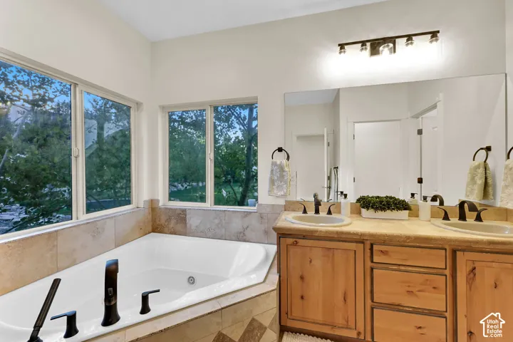 Dual vanity with wood-finish cabinetry and undermount sinks