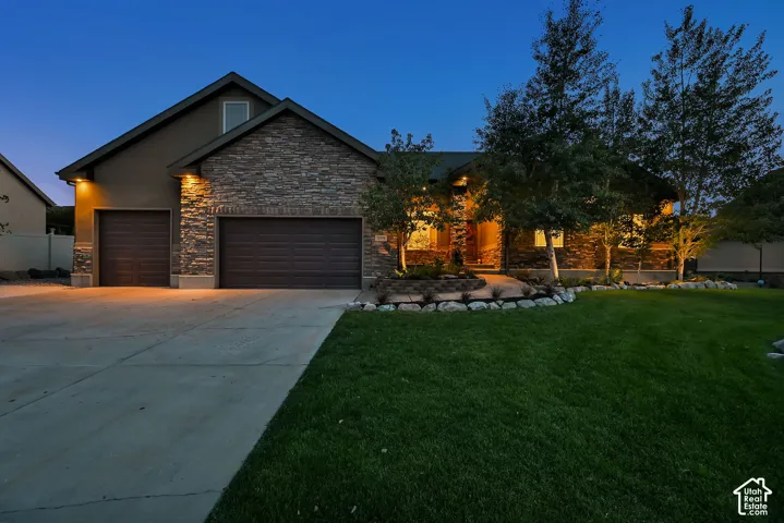 Stone veneer facade with stucco accents