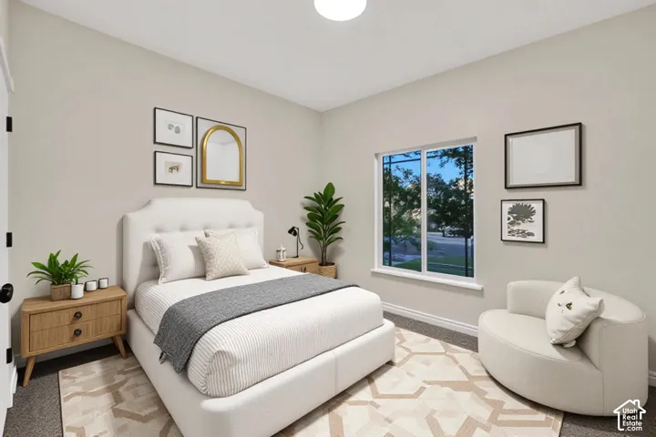 Neutral wall paint with window, flush-mounted ceiling light fixture, and wood-finish nightstands
