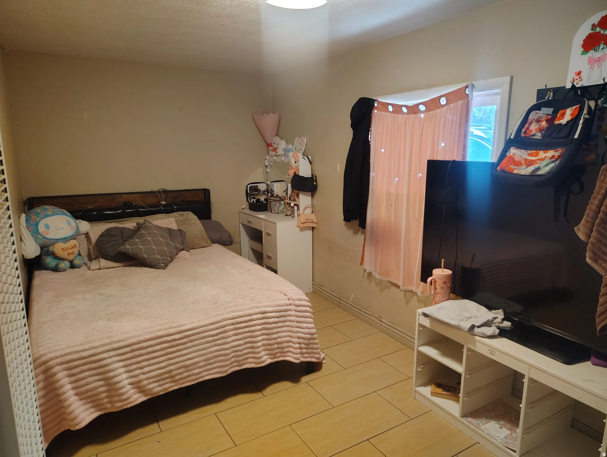 Neutral wall paint, tile flooring, and a single window