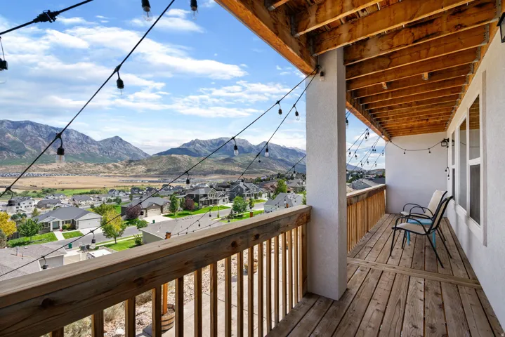 Expansive outdoor deck with wood flooring and railing