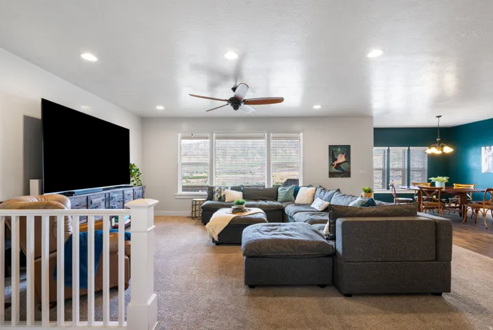 Argon gas filled windows, Recessed lighting, ceiling fan, large windows, and carpet flooring