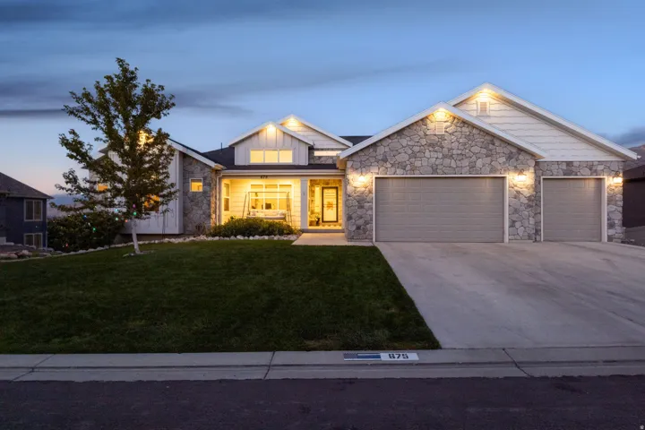 Stone and siding exterior with gabled roof lines