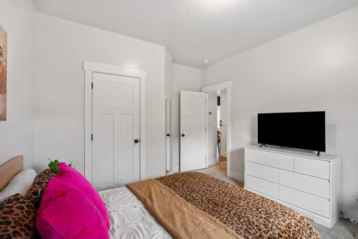White interior doors with dark hardware, recessed lighting, and light-toned walls