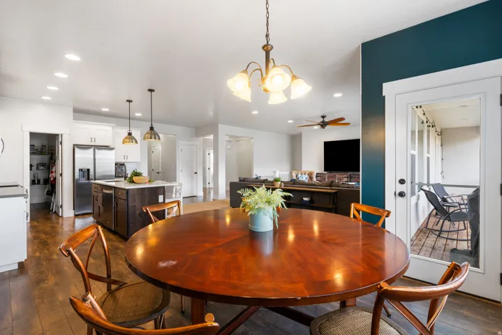 Kitchen featuring a central island with countertop, stainless steel refrigerator, and recessed lighting