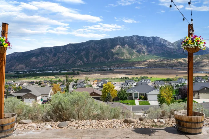Expansive mountainous backdrop over a residential landscape